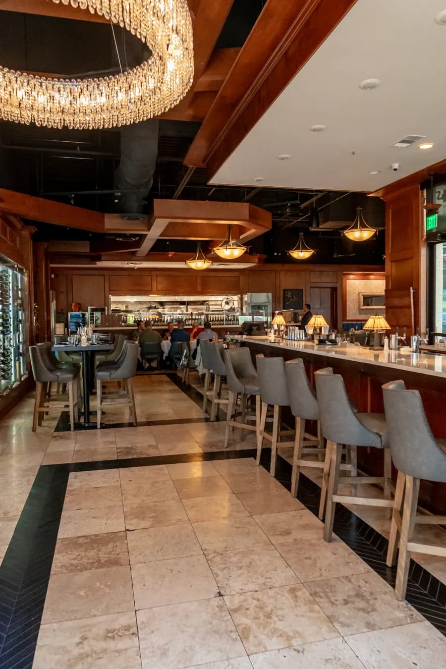 The bar and dining room at Luci's, with the chandelier over the tables
