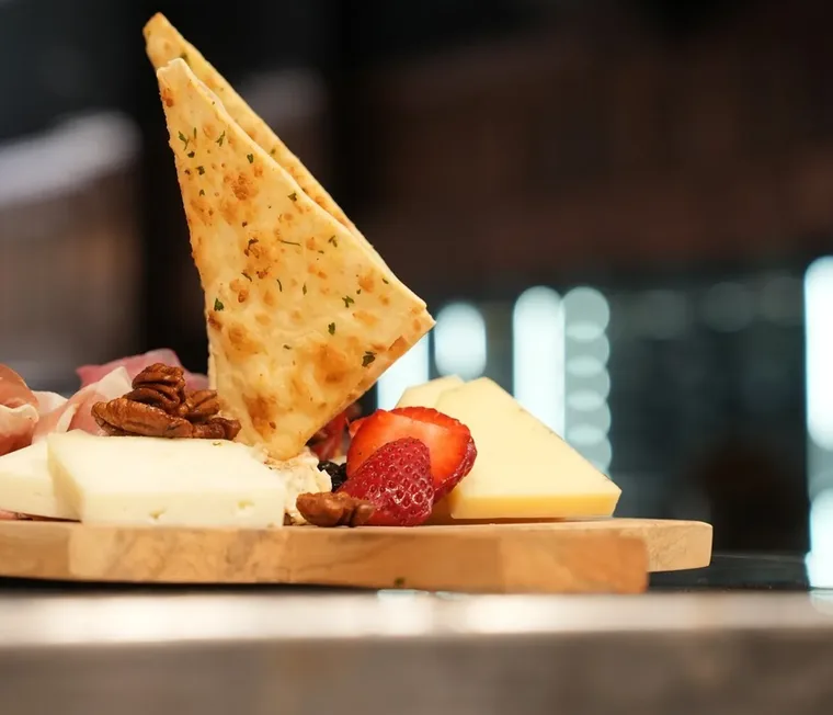 Cheese and charcuterie board with grilled flatbread